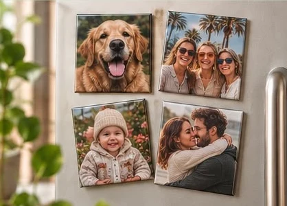 Four photo magnets of family, friends and a dog on a fridge door